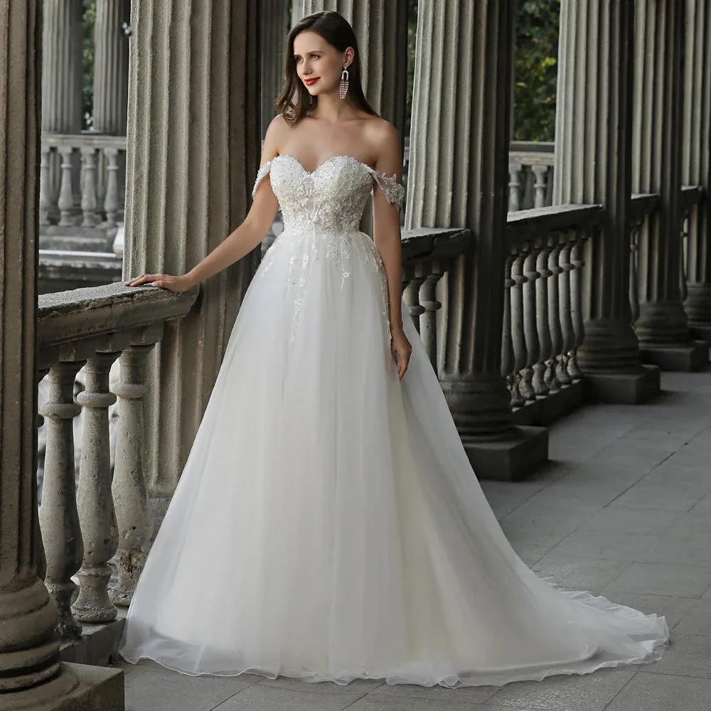 A-Line Enchantment: Sweetheart Lace Ivory Wedding Gown